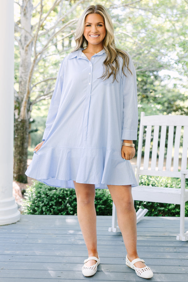 Chic soul plus size clothing, blue striped knee length dress with long sleeves and buttons going down the center of the dress with a ruffle flare at the end 
