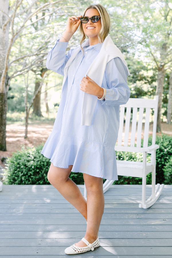 Chic soul plus size clothing, blue striped knee length dress with long sleeves and buttons going down the center of the dress with a ruffle flare at the end 
