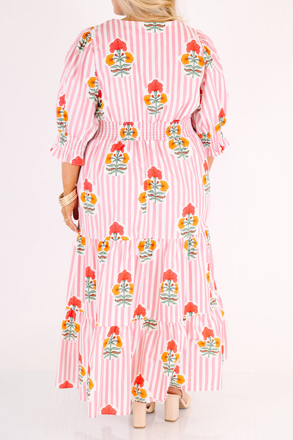 Chic Soul plus size clothing, orange striped maxi dress with half sleeves that have a ruffle flare out on the ends as well as a slight v-neckline and a floral block pattern throughout 
