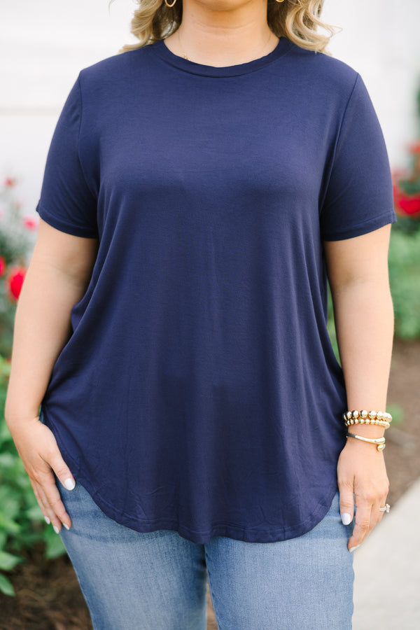 Navy short-sleeve tunic top with a crew neckline and a curved hemline.