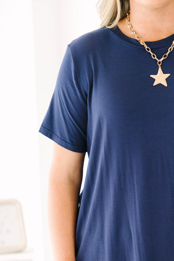 Short-sleeve navy blue crewneck tunic top with a relaxed fit and side splits.