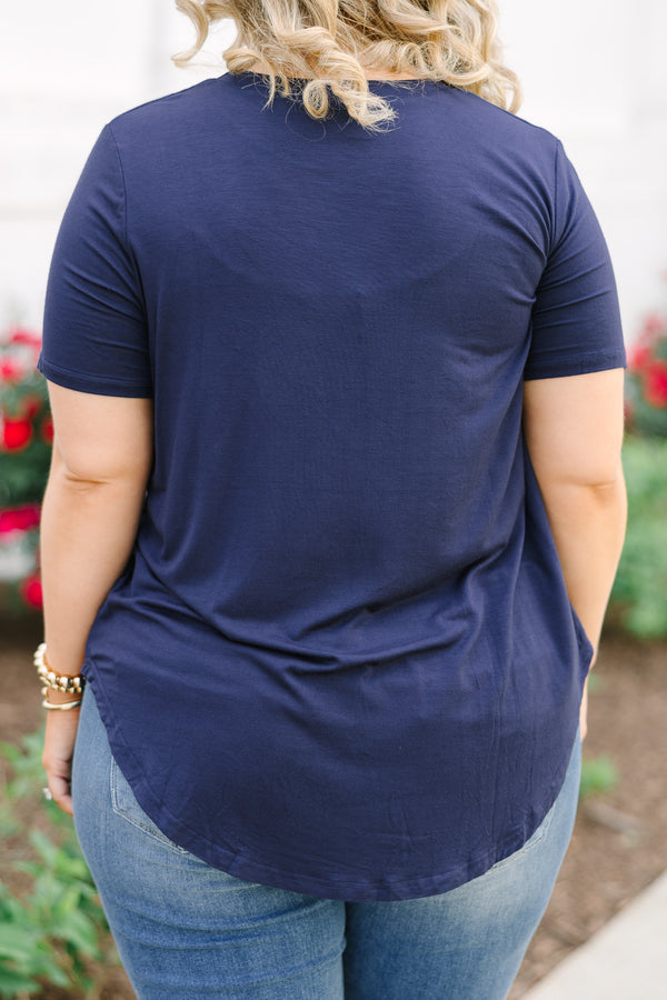 Back view of a navy short-sleeve tunic top with a curved high-low hemline.