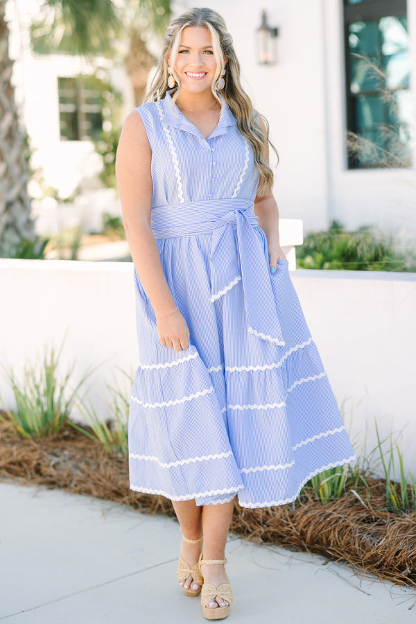 Chic Soul plus size clothing, blue sleeveless midi dress with collar, button down front, waist tie and white ricrac trim along the bottom of the dress and waist tie