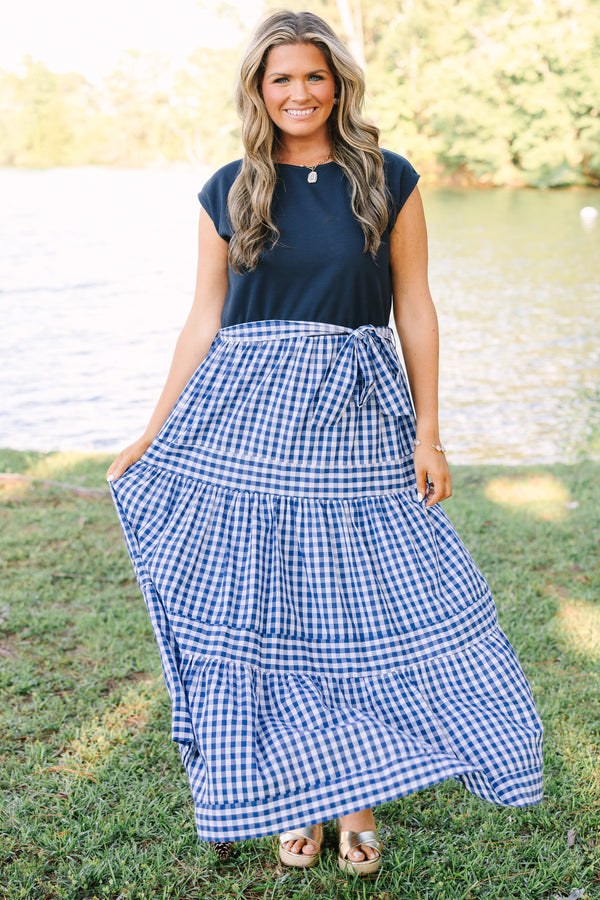 Plus size clothing, short sleeve tiered maxi dress with  a navy bodice and the skirt a navy blue and white gingham with a self-tie waist belt