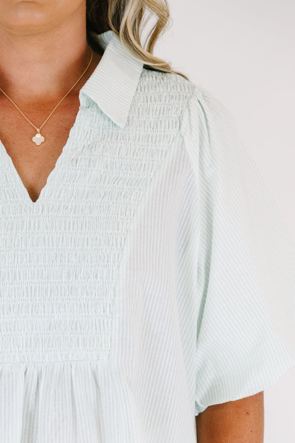 Plus Size green and white striped short puff sleeve top with a smocked bust and collar.