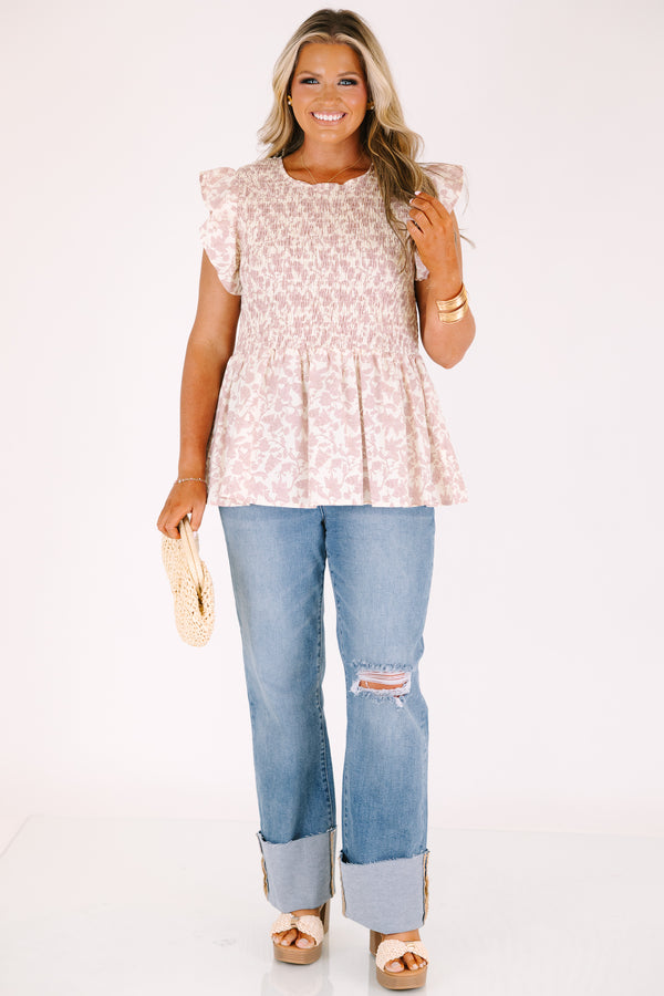 Chic Soul plus size clothing, a wide leg jean in a medium wash featuring thick cuffed bottom hems and a rip on one knee 