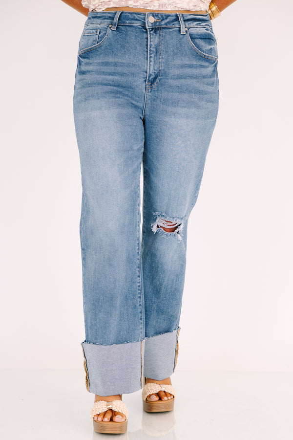 Chic Soul plus size clothing, a wide leg jean in a medium wash featuring thick cuffed bottom hems and a rip on one knee 