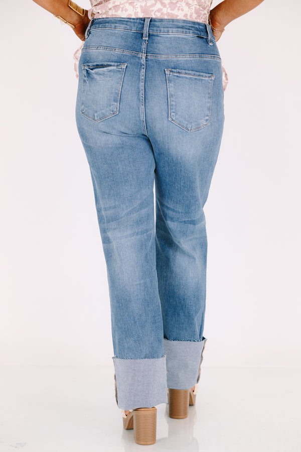 Chic Soul plus size clothing, a wide leg jean in a medium wash featuring thick cuffed bottom hems and a rip on one knee 