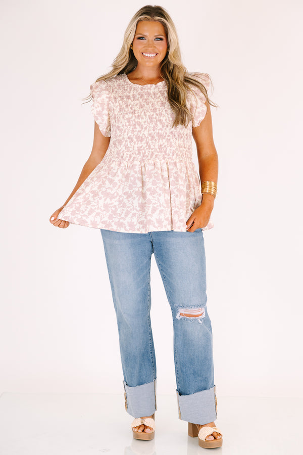 Chic Soul plus size clothing, a wide leg jean in a medium wash featuring thick cuffed bottom hems and a rip on one knee 