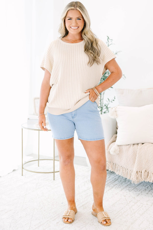 Plus Size light wash denim shorts with a high-waisted fit and classic five-pocket styling.