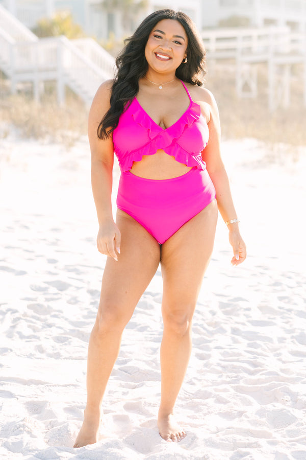 Chic Soul plus size clothing, hot pink one piece with a cut out on the stomach area as well as a deep v-neckline and ruffle details going along the neckline and under the bust 