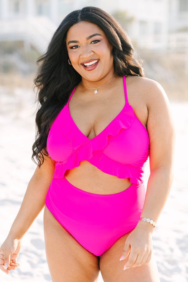 Chic Soul plus size clothing, hot pink one piece with a cut out on the stomach area as well as a deep v-neckline and ruffle details going along the neckline and under the bust 
