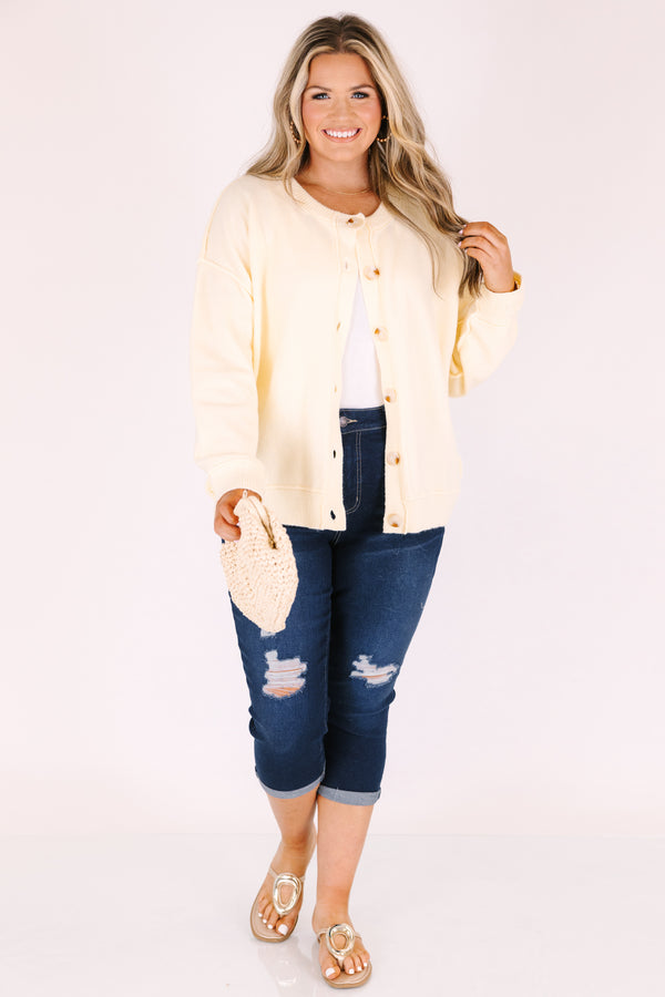 Chic Soul plus size clothing, dark wash capri jeans with front pockets and cuffs at the end of the pants as well as distressed holes on each leg of the pant