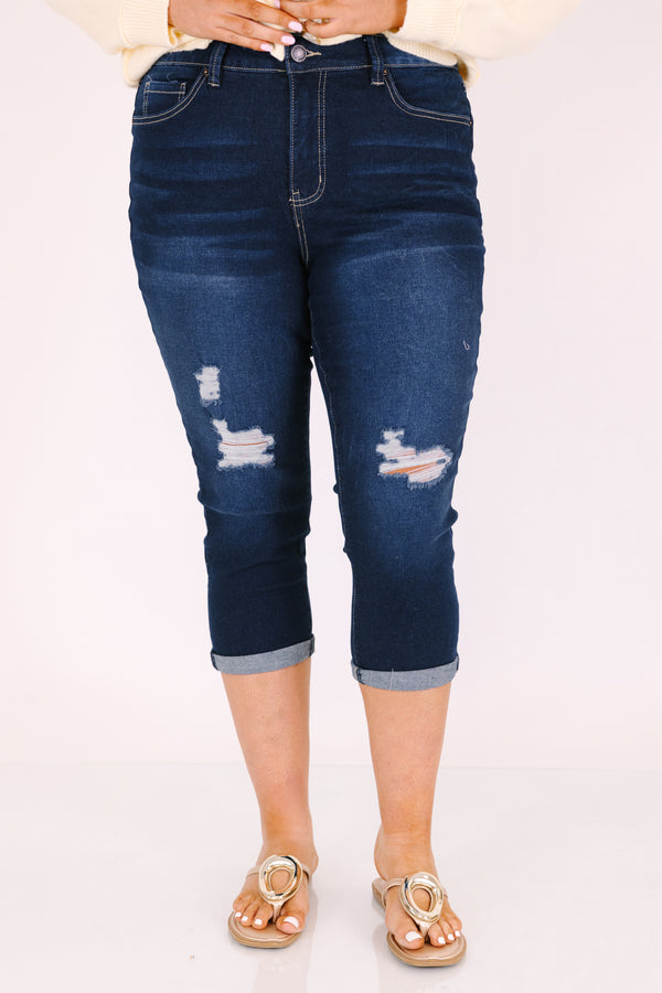 Chic Soul plus size clothing, dark wash capri jeans with front pockets and cuffs at the end of the pants as well as distressed holes on each leg of the pant