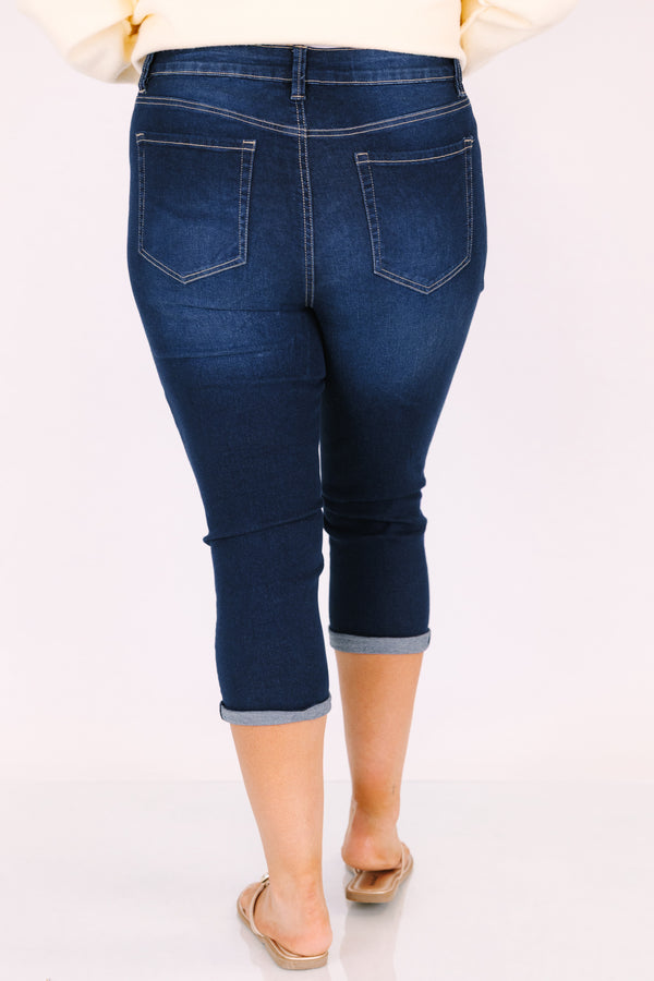 Chic Soul plus size clothing, dark wash capri jeans with front pockets and cuffs at the end of the pants as well as distressed holes on each leg of the pant