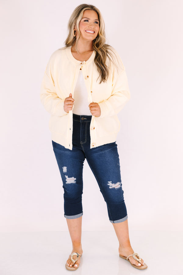 Chic Soul plus size clothing, dark wash capri jeans with front pockets and cuffs at the end of the pants as well as distressed holes on each leg of the pant