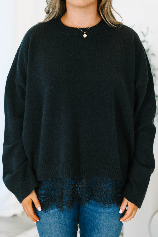Plus size black crewneck sweater with a relaxed fit and delicate lace trim hem.