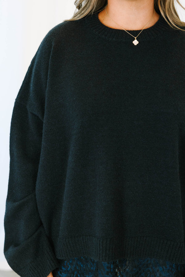 Plus size black crewneck sweater with a relaxed fit and delicate lace trim hem.