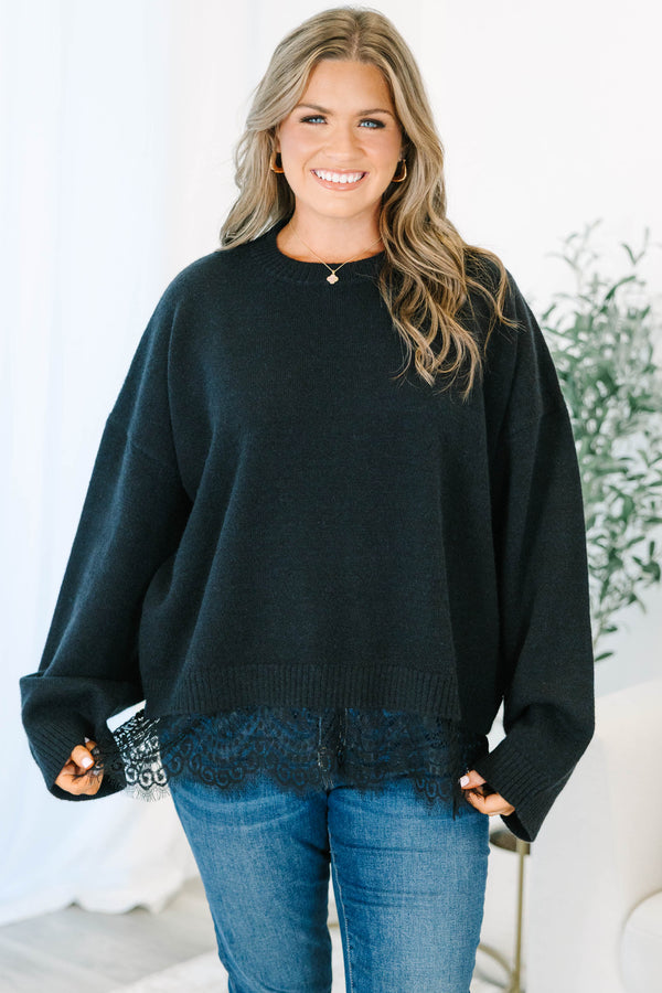 Plus size black crewneck sweater with a relaxed fit and delicate lace trim hem.