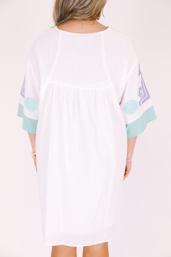 Chic Soul plus size clothing, white knee length dress with seafoam accents on the side of the dress at the end of the sleeves and a seafoam floral pattern on the chest and sleeves area as well as half sleeves and a v-neckline 