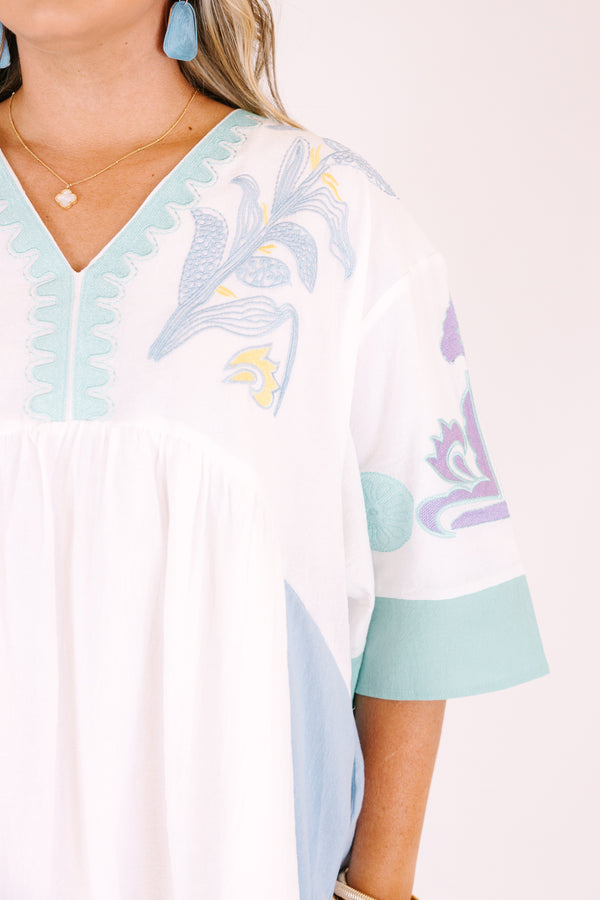 Chic Soul plus size clothing, white knee length dress with seafoam accents on the side of the dress at the end of the sleeves and a seafoam floral pattern on the chest and sleeves area as well as half sleeves and a v-neckline 