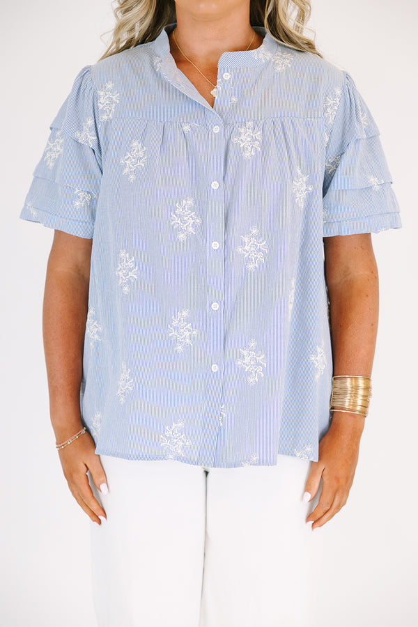 Plus Size light blue striped button-down top with floral embroidery and a collared neckline.