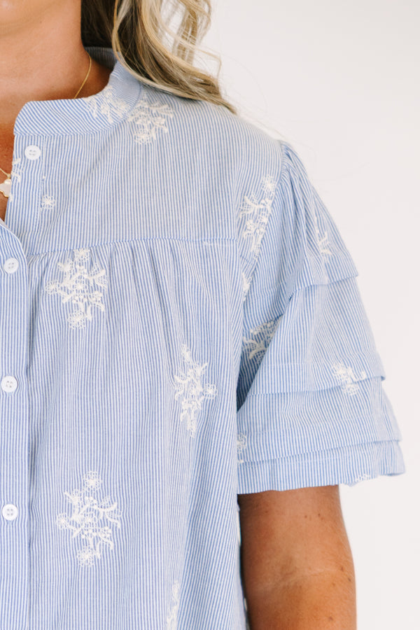 Plus Size light blue striped button-down top with floral embroidery and a collared neckline.