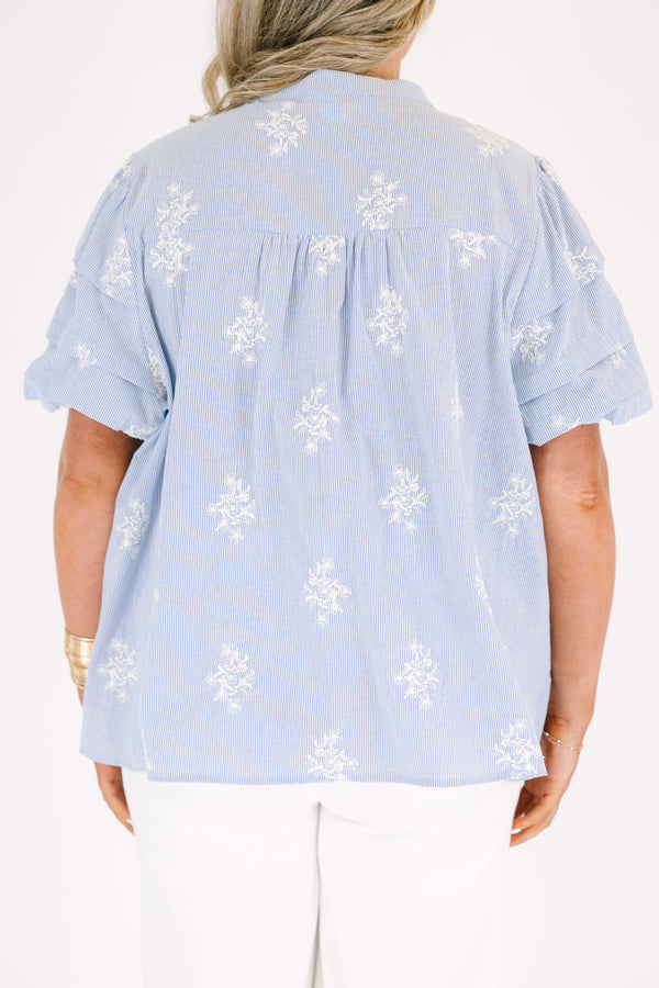 Plus Size light blue striped button-down top with floral embroidery and a collared neckline.