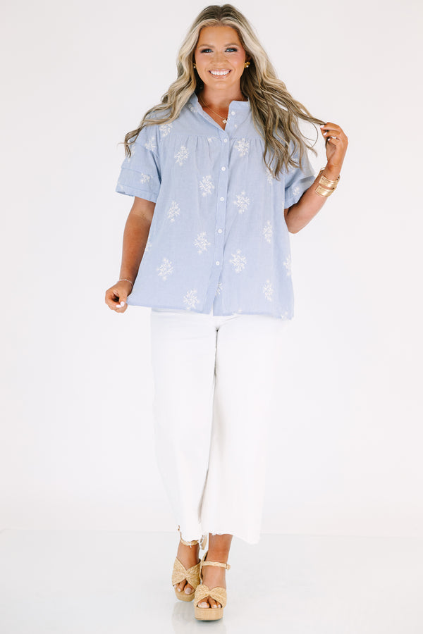 Plus Size light blue striped button-down top with floral embroidery and a collared neckline.