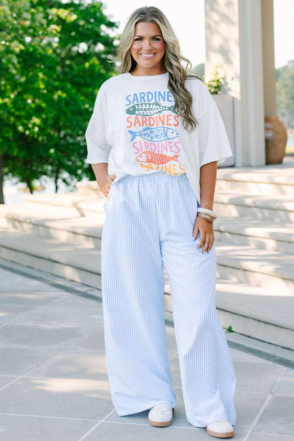 Plus size light blue and white vertical striped wide-leg pants with an elastic waistband and flowy fit.