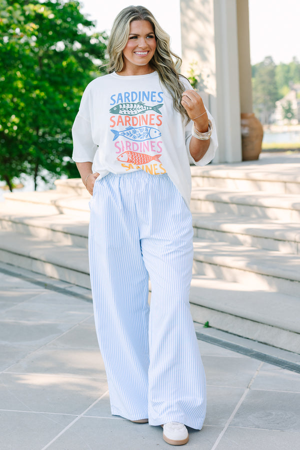Plus size light blue and white vertical striped wide-leg pants with an elastic waistband and flowy fit.
