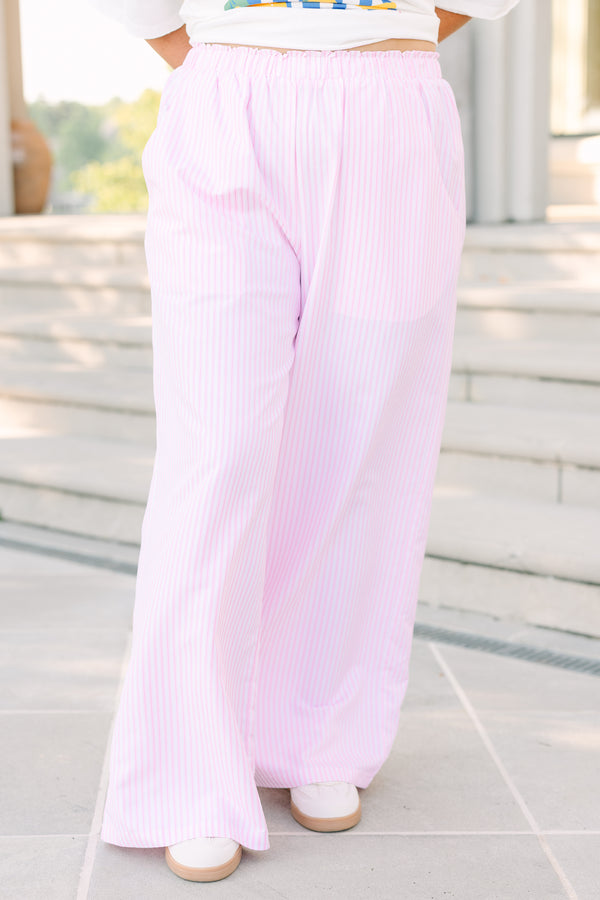 Plus Size pink and white vertical striped wide-leg pants with an elastic waistband and pockets.