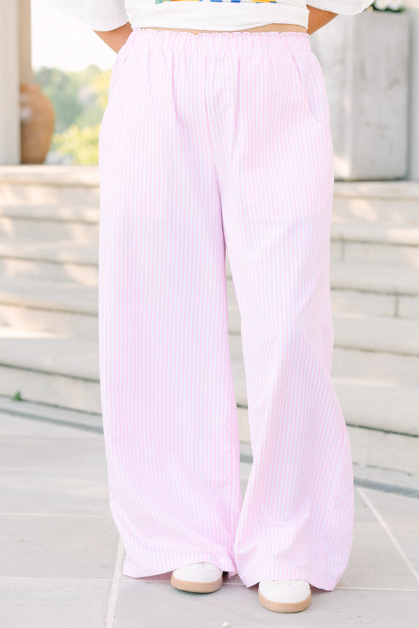 Plus Size pink and white vertical striped wide-leg pants with an elastic waistband and pockets.