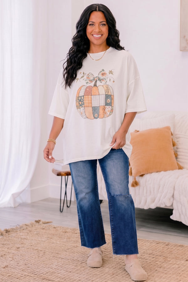 Chic Soul plus size clothing, ivory short sleeve boyfriend tee with patchwork pumpkin in the middle and a bow on the stem
