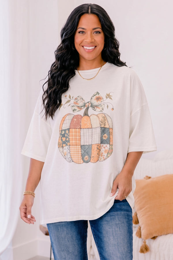 Chic Soul plus size clothing, ivory short sleeve boyfriend tee with patchwork pumpkin in the middle and a bow on the stem