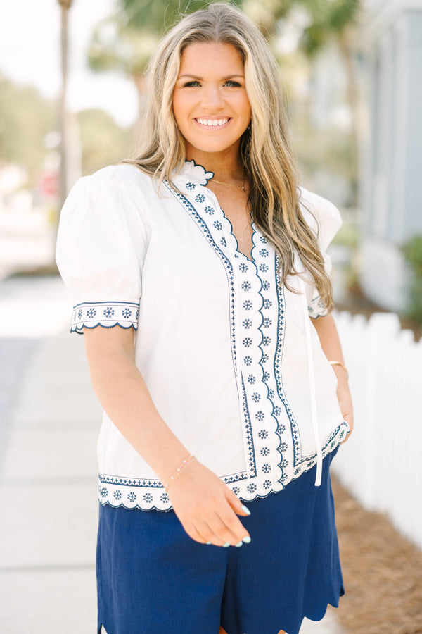 Chic Soul plus size clothing, white puff short sleeve top with scallop trim lined in navy blue along the sleeves and middle of the top with blue floral pattern inside scalloped trimming