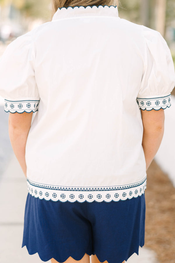 Chic Soul plus size clothing, white puff short sleeve top with scallop trim lined in navy blue along the sleeves and middle of the top with blue floral pattern inside scalloped trimming