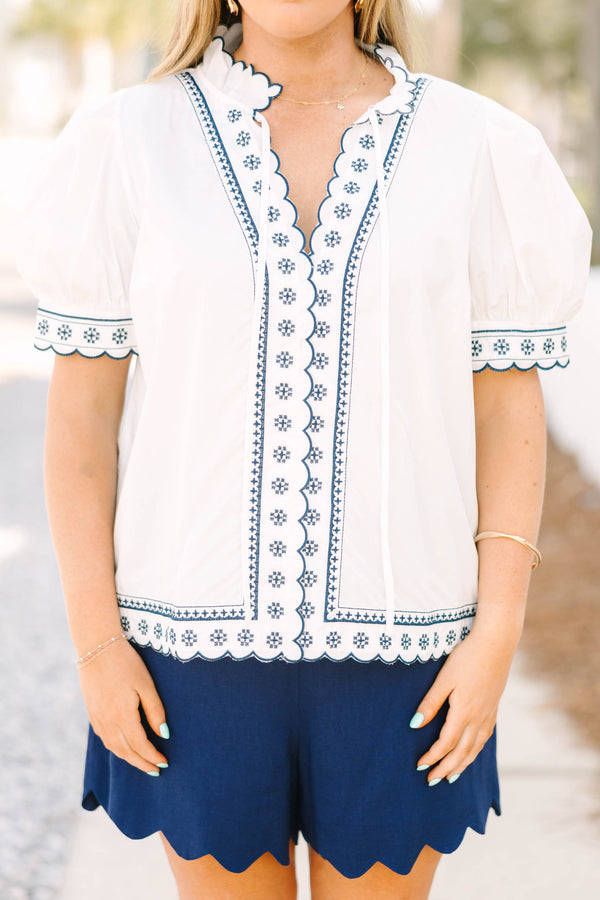 Chic Soul plus size clothing, white puff short sleeve top with scallop trim lined in navy blue along the sleeves and middle of the top with blue floral pattern inside scalloped trimming