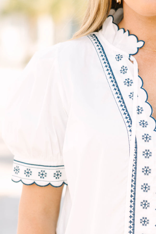 Chic Soul plus size clothing, white puff short sleeve top with scallop trim lined in navy blue along the sleeves and middle of the top with blue floral pattern inside scalloped trimming