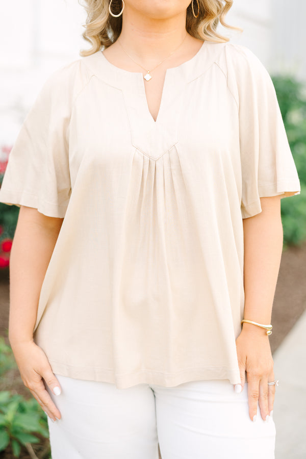 Taupe rayon-linen blend top with a V-neckline, short sleeves, and pleated front detail.