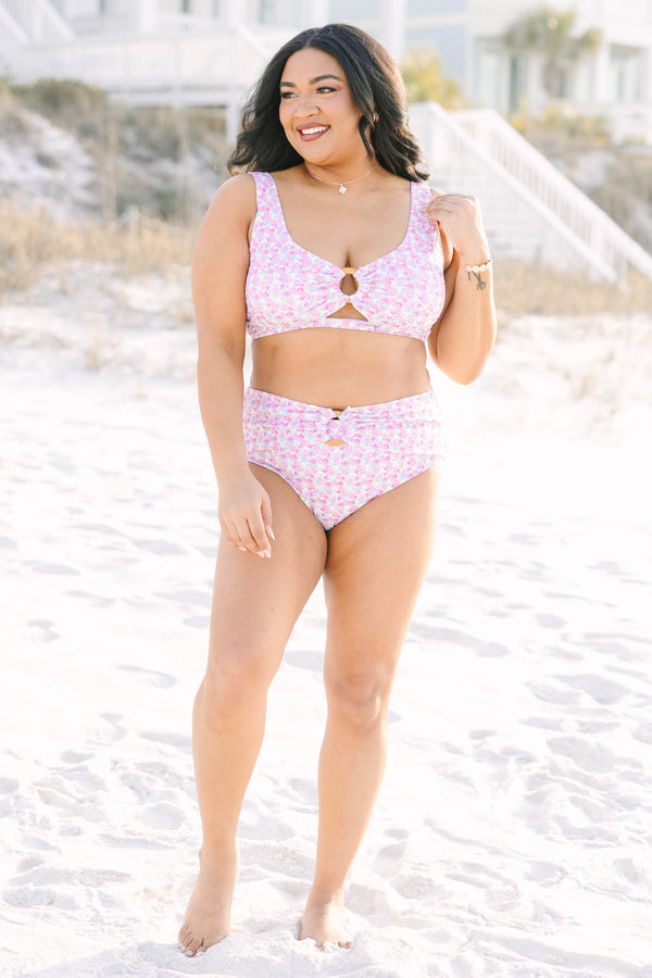 Chic soul plus size clothing, high waisted pink floral swim bottoms with am overlay that goes across that top of the bottom that has a woven circle belt detail in the middle of the bottom 