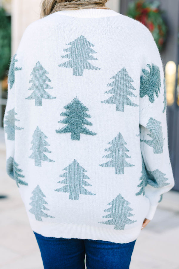 Plus Size white crewneck sweater with green evergreen tree patterns and pearl embellishments.