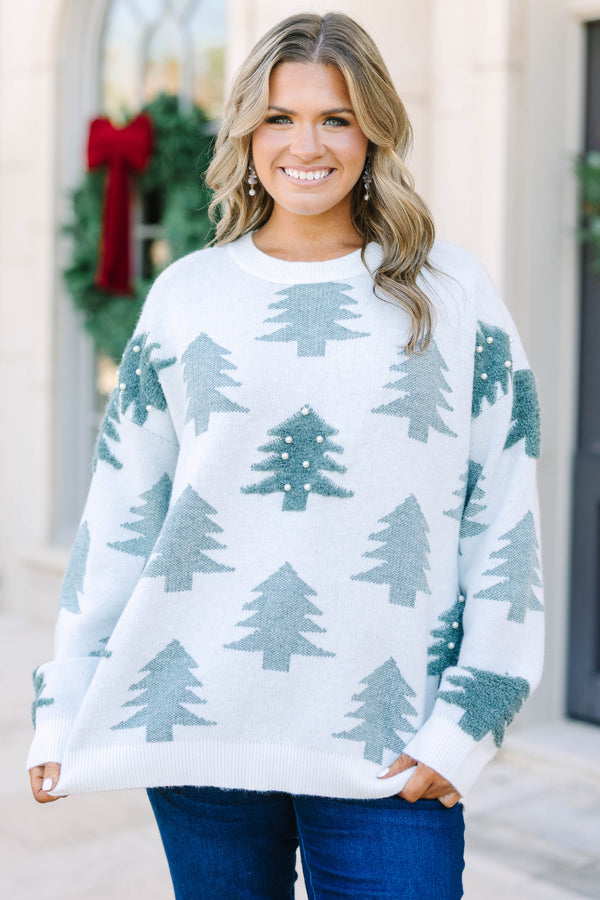 Plus Size white crewneck sweater with green evergreen tree patterns and pearl embellishments.