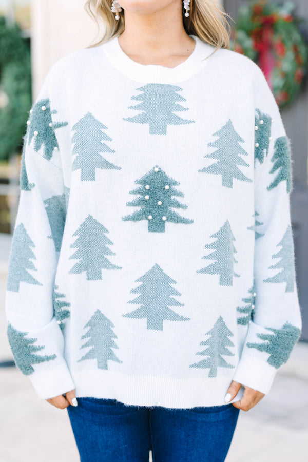 Plus Size white crewneck sweater with green evergreen tree patterns and pearl embellishments.