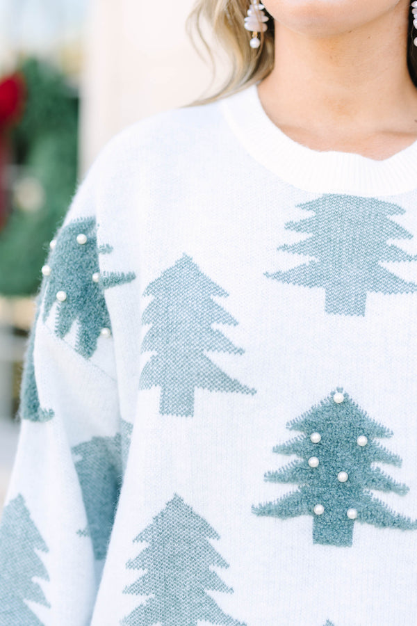 Plus Size white crewneck sweater with green evergreen tree patterns and pearl embellishments.