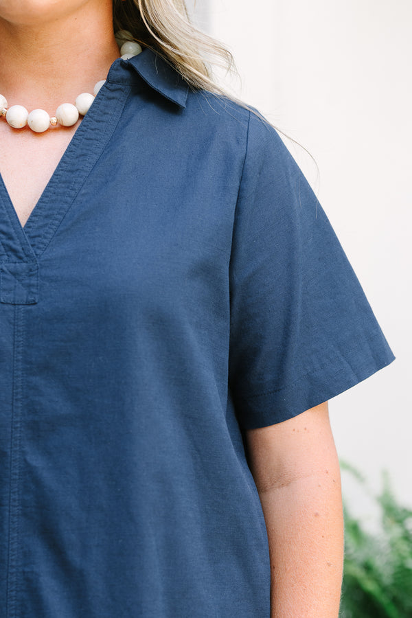 Chic Soul Plus Size Clothing, a short navy blue dress with short sleeves and a collared V-neck. Features side-seam pockets. 