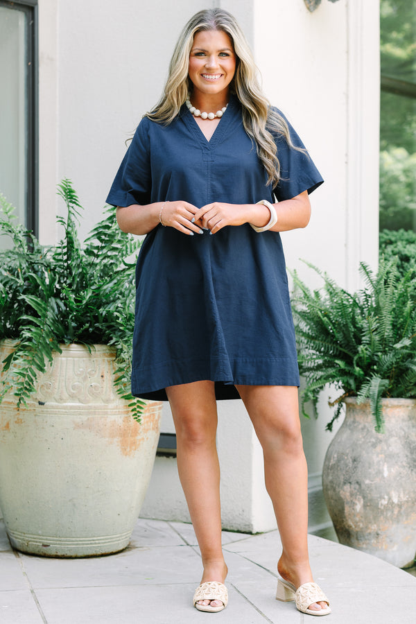 Chic Soul Plus Size Clothing, a short navy blue dress with short sleeves and a collared V-neck. Features side-seam pockets. 