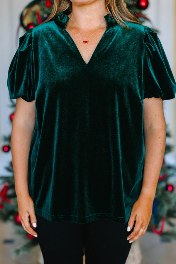 Plus Size emerald green velvet top with short puff sleeves and a V-neckline.