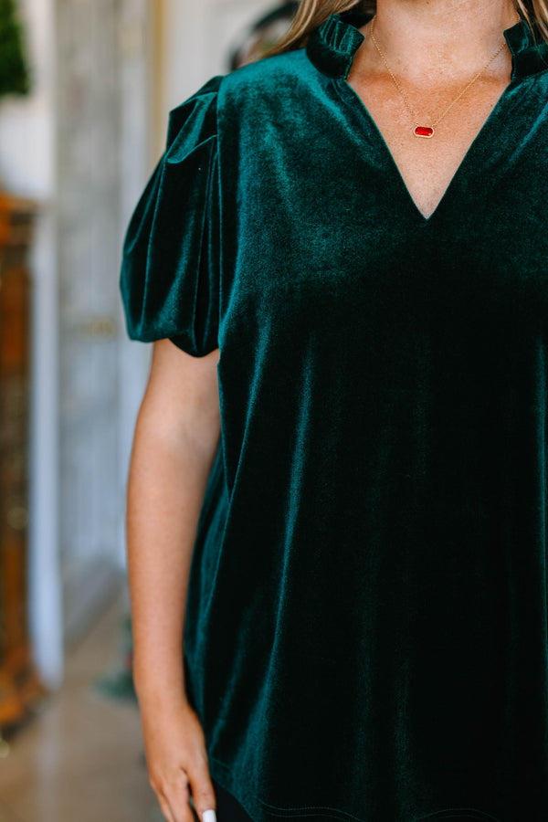 Plus Size emerald green velvet top with short puff sleeves and a V-neckline.
