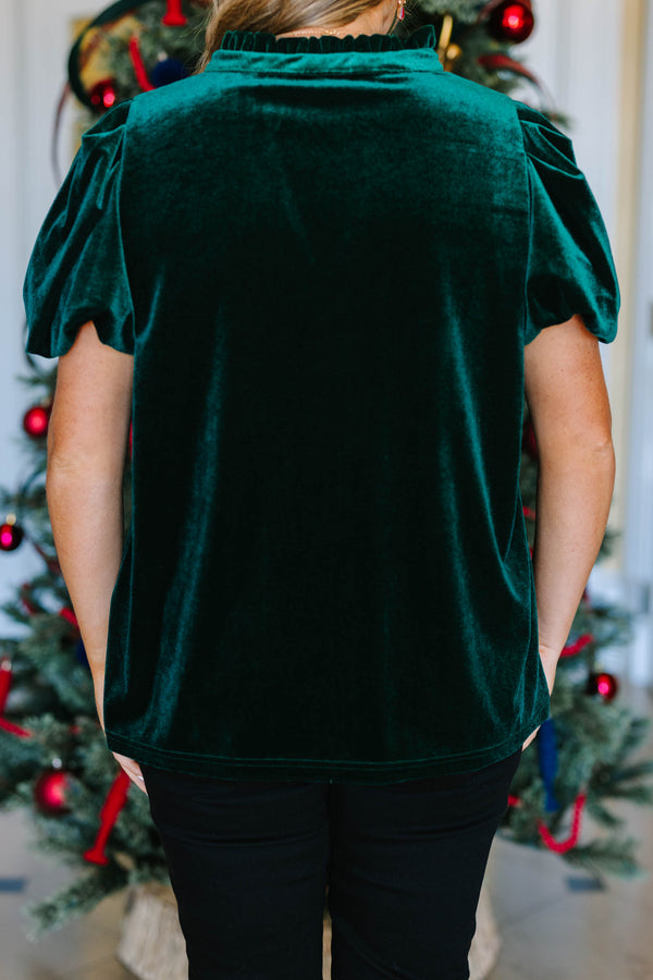 Plus Size emerald green velvet top with short puff sleeves and a V-neckline.